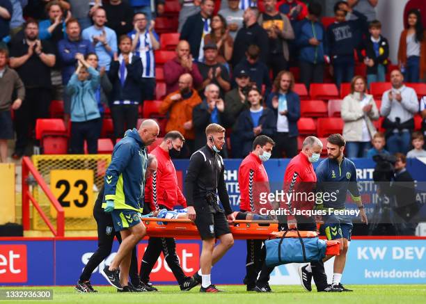 Callum Paterson of Sheffield Wednesday is stretchered off the pitch after picking up an injury during the Sky Bet League One match between Charlton...