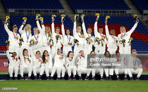 Team USA celebrate with their Bronze Medal following the Medal ceremony after the Gold Medal Match Women's Football match between Canada and Sweden...