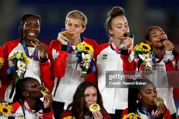 Gold medalist Quinn of Team Canada reacts with their gold medal after becoming the first openly transgender athlete to win Olympic gold during the...