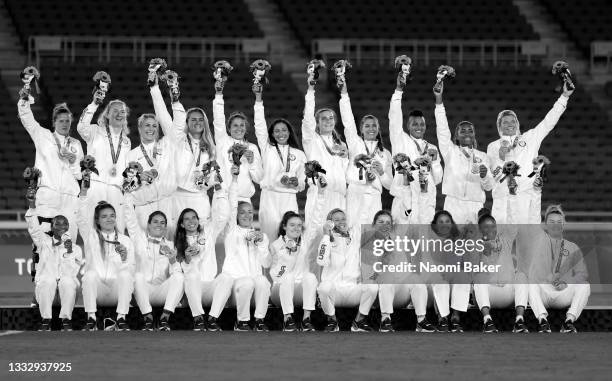 Team USA celebrate with their Bronze Medal following the Medal ceremony after the Gold Medal Match Women's Football match between Canada and Sweden...