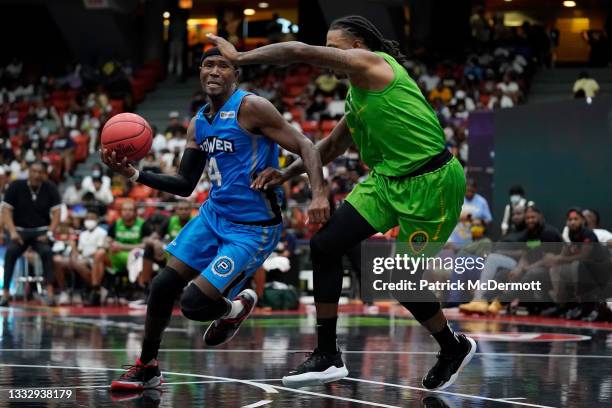 Derrick Byars of the Power dribbles the ball while being guarded by Brandon Rush of the Aliens during BIG3 - Week Six at Credit Union 1 Arena on...