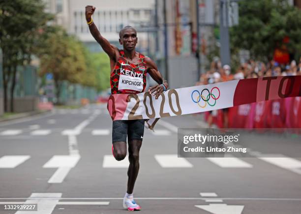 Eliud Kipchoge of Team Kenya crosses the finish line during the Men's Marathon Final on day sixteen of the Tokyo 2020 Olympic Games at Sapporo Odori...