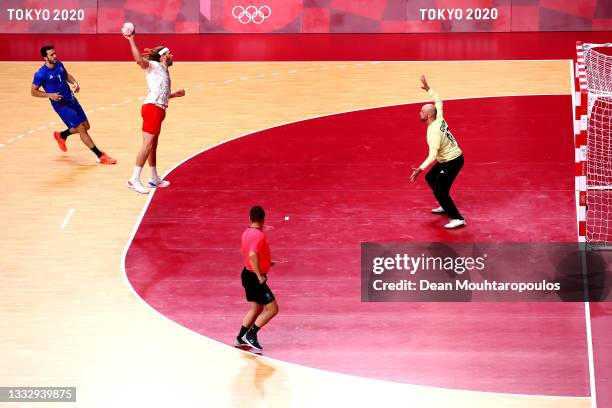 Mikkel Hansen of Team Denmark shoots at Goalkeeper, Vincent Gerard of Team France during the Men's Gold Medal handball match between France and...