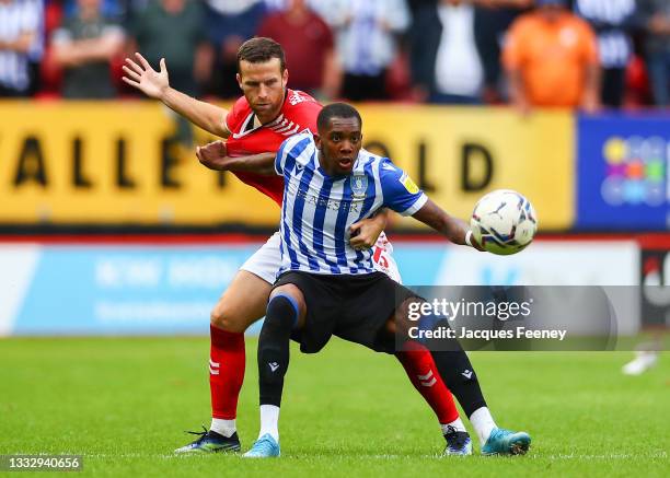 Jaden Brown of Sheffield Wednesday battles for possession with Adam Matthews of Charlton Athletic during the Sky Bet League One match between...