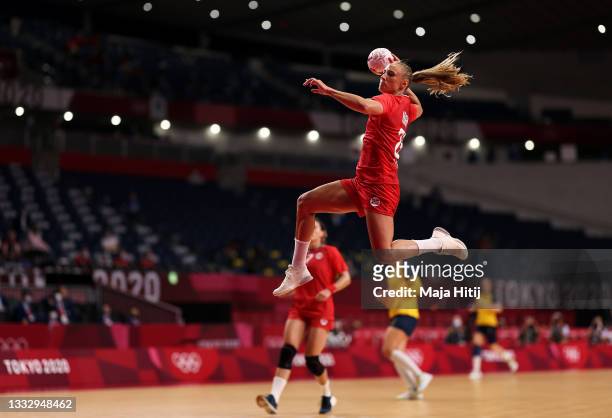 Camilla Herrem of Team Norway shoots at goal during the Women's Bronze Medal handball match between Norway and Sweden on day sixteen of the Tokyo...