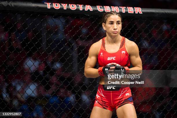Tecia Torres stands in her corner between rounds against Angela Hill in their women's strawweight bout during the UFC 265 event at Toyota Center on...