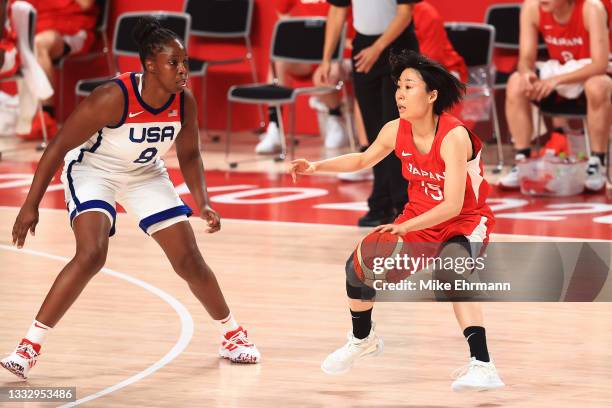 Nako Motohashi of Team Japan prepares to drive to the basket against Chelsea Gray of Team United States during the first half of the Women's...