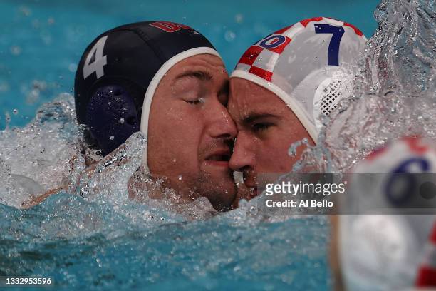 Alex Obert of Team United States and Ante Vukicevic of Team Croatia collide during the Men’s Classification 5th-6th match between Croatia and the...
