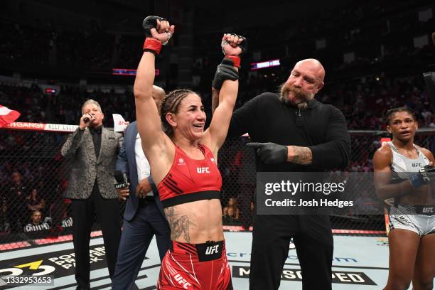 Tecia Torres reacts after defeating Angela Hill in their women's strawweight bout during the UFC 265 event at Toyota Center on August 07, 2021 in...