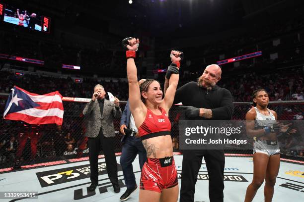 Tecia Torres reacts after defeating Angela Hill in their women's strawweight bout during the UFC 265 event at Toyota Center on August 07, 2021 in...