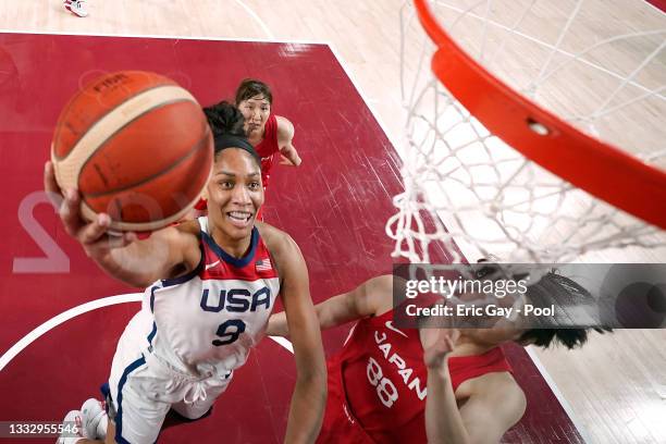 Ja Wilson of Team United States drives to the basket against Himawari Akaho of Team Japan during the second half of the Women's Basketball final game...