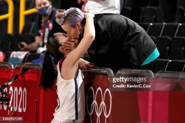 Sue Bird of Team United States kisses Megan Rapinoe in celebration after the United States' win over Japan in the Women's Basketball final game on...