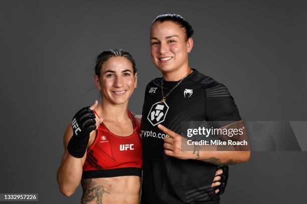 Tecia Torres poses with Raquel Pennington for a post fight portrait backstage during the UFC 265 event at Toyota Center on August 07, 2021 in...