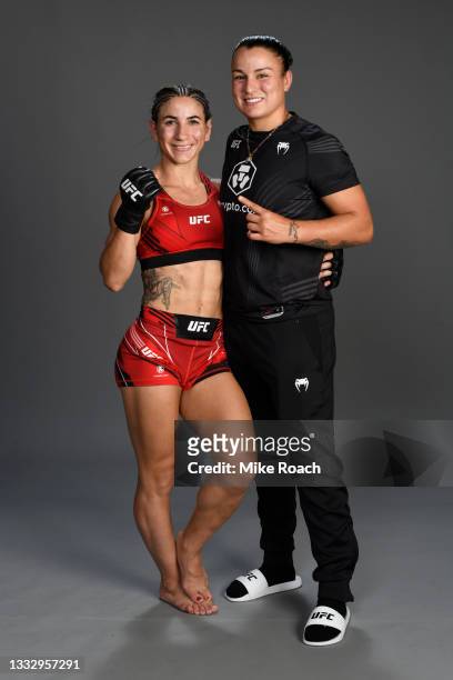 Tecia Torres poses with Raquel Pennington for a post fight portrait backstage during the UFC 265 event at Toyota Center on August 07, 2021 in...