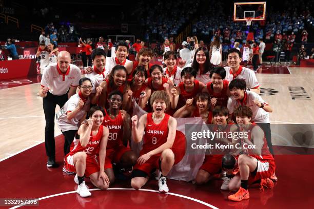 Team Japan celebrates taking the silver medal after the Women's Basketball final game between Team United States and Team Japan on day sixteen of the...