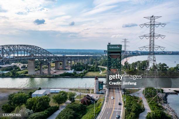 burlington bay james n. allan skyway and queen elizabeth way, burlington lift bridge, burlington, canada - hamilton stock pictures, royalty-free photos & images