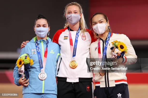 Silver medalist Olena Starikova of Team Ukraine, gold medalist Kelsey Mitchell of Team Canada, and bronze medalist Wai Sze Lee of Team Hong Kong,...