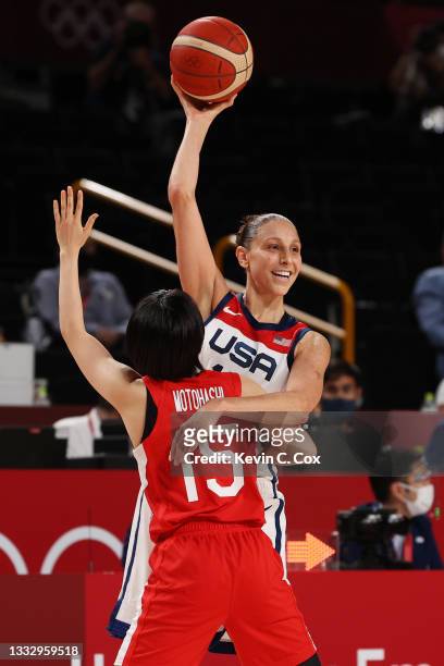 Diana Taurasi of Team United States is defended by Nako Motohashi of Team Japan during the second half of the Women's Basketball final game on day...