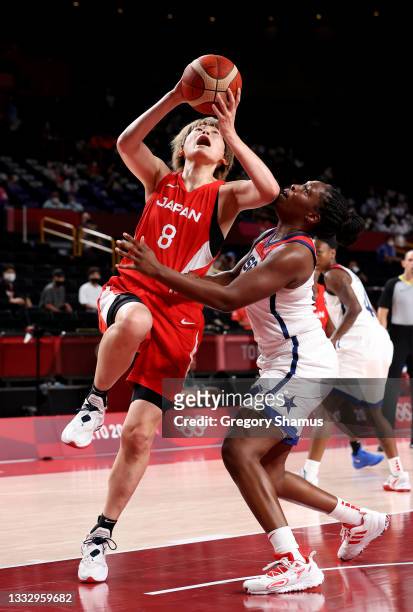 Maki Takada of Team Japan attempts a shot against Chelsea Gray of Team United States during the second half of the Women's Basketball final game on...