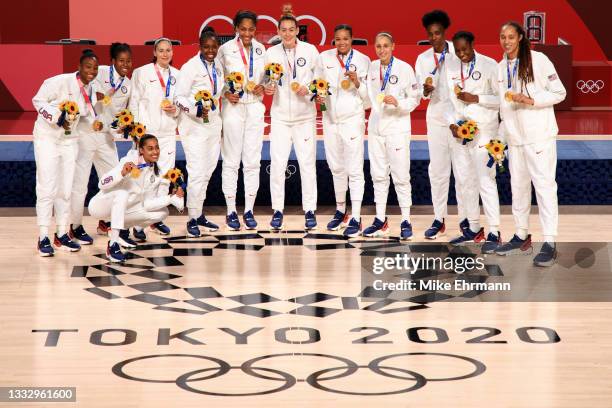 Team United States pose for photographs with their gold medals during the Women's Basketball medal ceremony on day sixteen of the 2020 Tokyo Olympic...