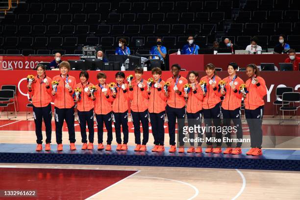 Team Japan pose for photographs with their silver medals during the Women's Basketball medal ceremony on day sixteen of the 2020 Tokyo Olympic games...