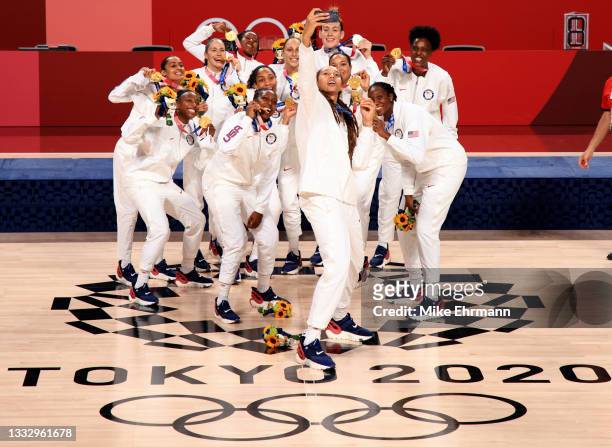 Team United States celebrate with their gold medals during the Women's Basketball medal ceremony on day sixteen of the 2020 Tokyo Olympic games at...