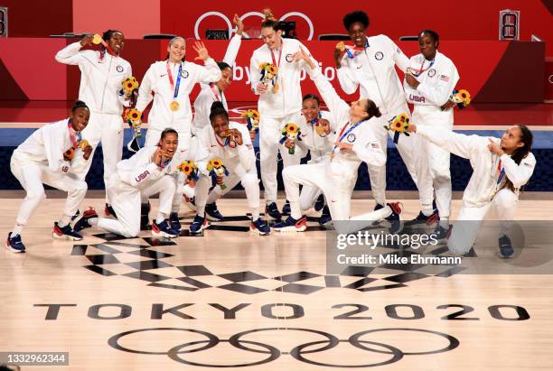 Team United States celebrate with their gold medals during the Women's Basketball medal ceremony on day sixteen of the 2020 Tokyo Olympic games at...