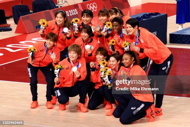 Team Japan pose for photographs with their silver medals during the Women's Basketball medal ceremony on day sixteen of the 2020 Tokyo Olympic games...