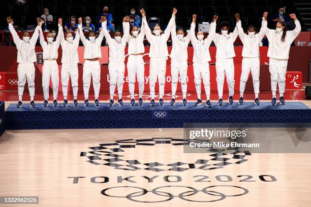 Team United States celebrates on the medal stand during the Women's Basketball medal ceremony on day sixteen of the 2020 Tokyo Olympic games at...