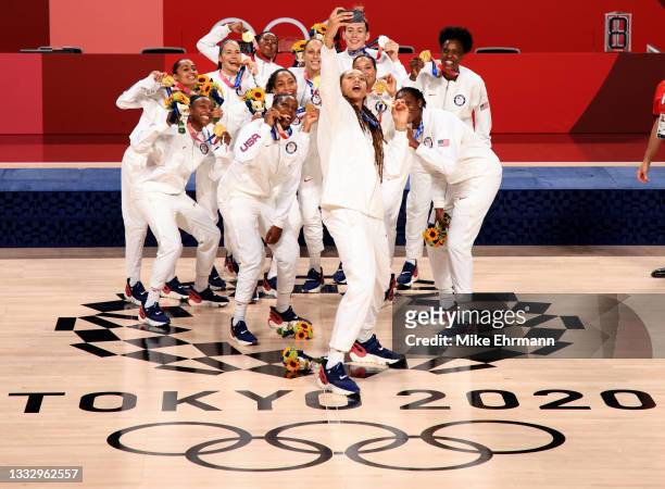 Team United States take a selfie with their gold medals during the Women's Basketball medal ceremony on day sixteen of the 2020 Tokyo Olympic games...