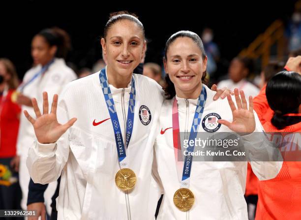Diana Taurasi and Sue Bird of Team United States pose for photographs with their gold medals during the Women's Basketball medal ceremony on day...