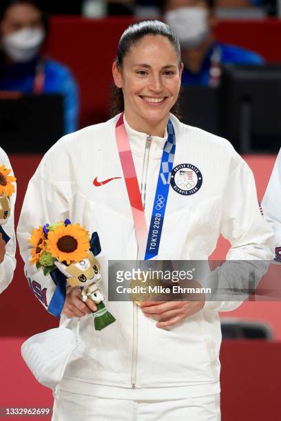 Sue Bird of Team United States poses for photographs with her gold medal during the Women's Basketball medal ceremony on day sixteen of the 2020...