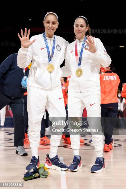 Sue Bird of Team United States and Diana Taurasi pose for photographs with their gold medals during the Women's Basketball medal ceremony on day...