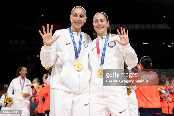 Diana Taurasi and Sue Bird of Team United States pose for photographs with their gold medals during the Women's Basketball medal ceremony on day...