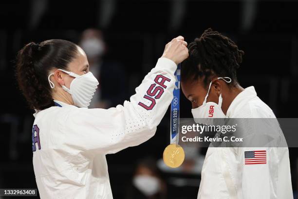 Sue Bird of Team United States presents Ariel Atkins with her gold medal during the Women's Basketball medal ceremony on day sixteen of the 2020...