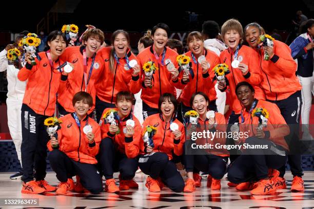 Team Japan pose for photographs with their silver medals during the Women's Basketball medal ceremony on day sixteen of the 2020 Tokyo Olympic games...