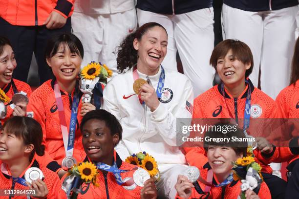 Sue Bird of Team United States reacts with members of Team Japan during the Women's Basketball medal ceremony on day sixteen of the 2020 Tokyo...
