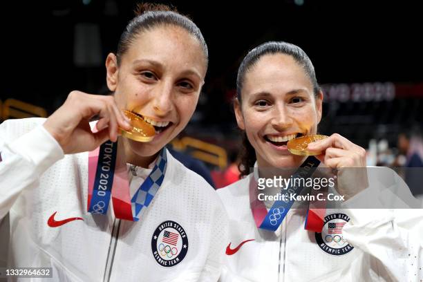 Diana Taurasi and Sue Bird of Team United States bite their gold medals during the Women's Basketball medal ceremony on day sixteen of the 2020 Tokyo...