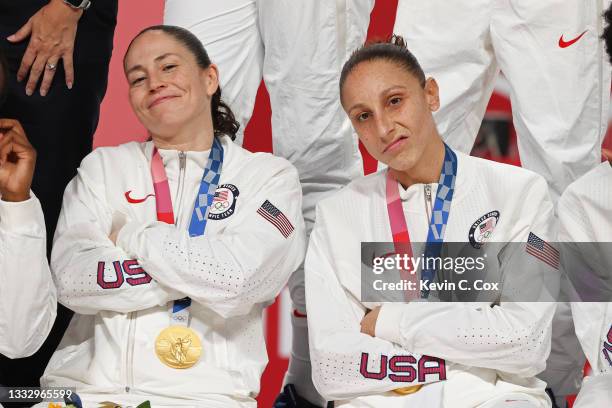 Sue Bird of Team United States and teammate Diana Taurasi pose for photographs with their gold medals during the Women's Basketball medal ceremony on...