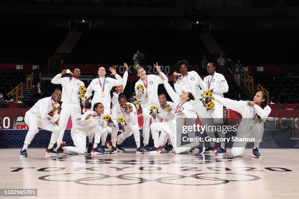 Team United States pose for photographs with their gold medals during the Women's Basketball medal ceremony on day sixteen of the 2020 Tokyo Olympic...