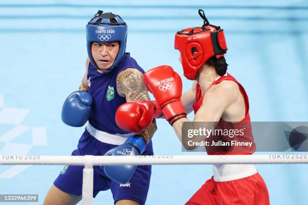 Kellie Anne Harrington of Team Ireland dodges a punch from Beatriz Ferreira of Team Brazil during the Women's Light Final bout between Kellie Anne...