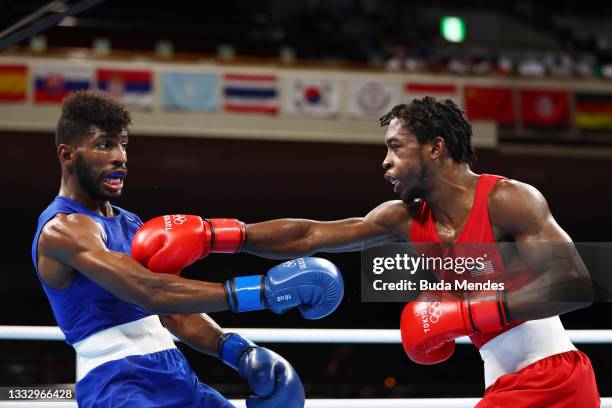 Andy Cruz of Team Cuba dodges a punch from Keyshawn Davis of Team United States during the Men's Light Final bout between Keyshawn Davis of Team...