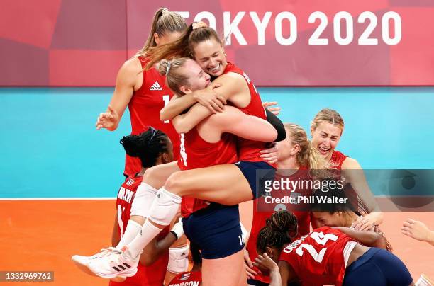 Players of Team United States react after defeating Team Brazil during the Women's Gold Medal Match on day sixteen of the Tokyo 2020 Olympic Games at...