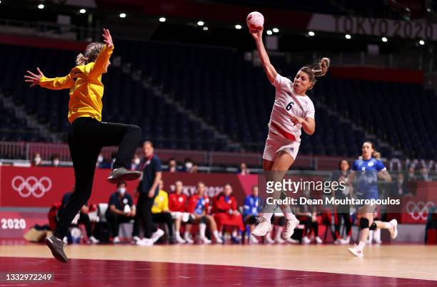 Chloe Valentini of Team France shoots at goal as Anna Sedoykina of Team ROC looks to save during the Women's Gold Medal handball match between ROC...
