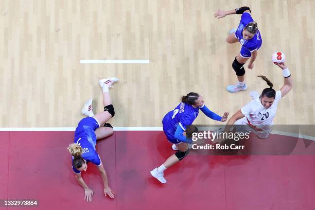 Laura Flippes of Team France shoots at goal while under pressure from Polina Vedekhina of Team ROC during the Women's Gold Medal handball match...