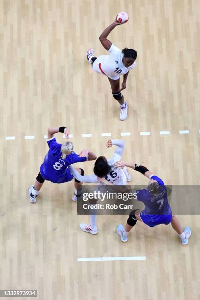 Grace Zaadi Deuna of Team France shoots at goal as Anna Sen and and Daria Dmitrieva of Team ROC defend during the Women's Gold Medal handball match...