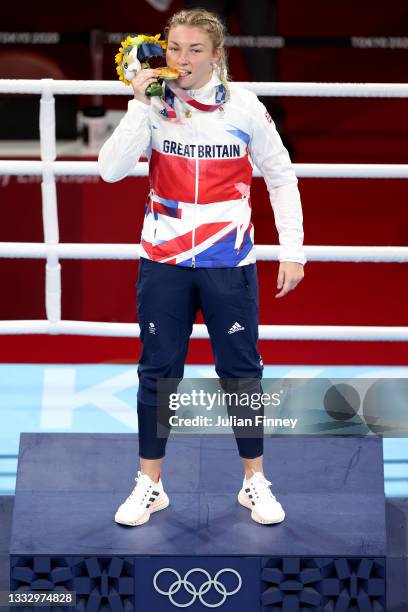Lauren Price of Team Great Britain celebrates with her gold medal during the medal ceremony for the Women's Middle Final bout between Lauren Price of...