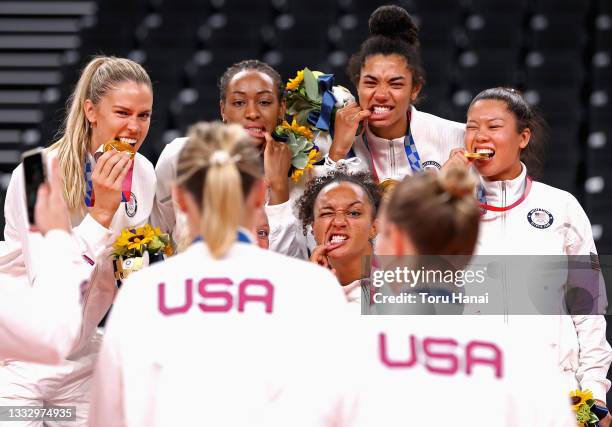 Players of Team United States react after receiving their Gold Medals during the Victory Ceremony following the Women's Gold Medal Volleyball match...