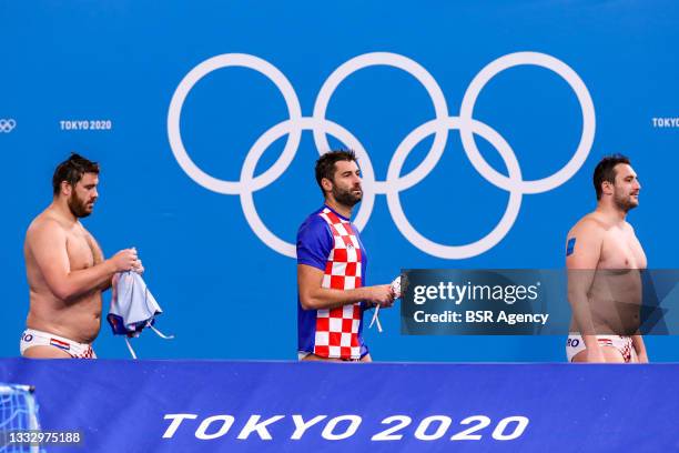 Josip Vrlic of Croatia, Xavi Garcia of Croatia and Paulo Obradovic of Croatia during the Tokyo 2020 Olympic Water Polo Tournament Men's...