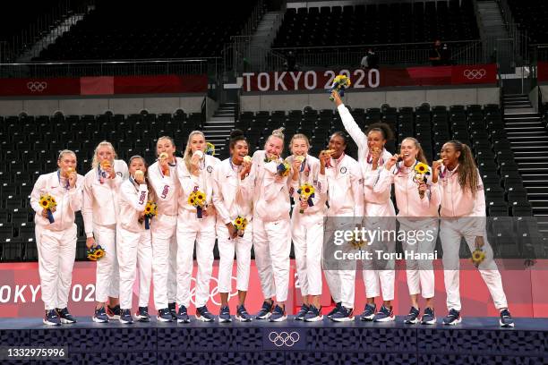 Players of Team United States react as they receive their Gold Medals during the Victory Ceremony following the Women's Gold Medal Volleyball match...